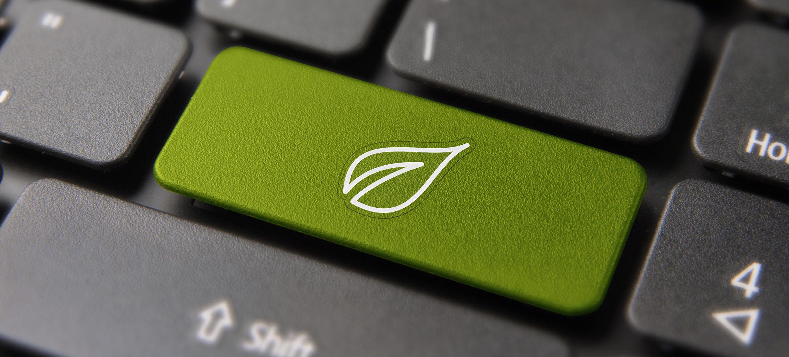Zielony przycisk na klawiaturze z symbolem ekologii - tytułowa.